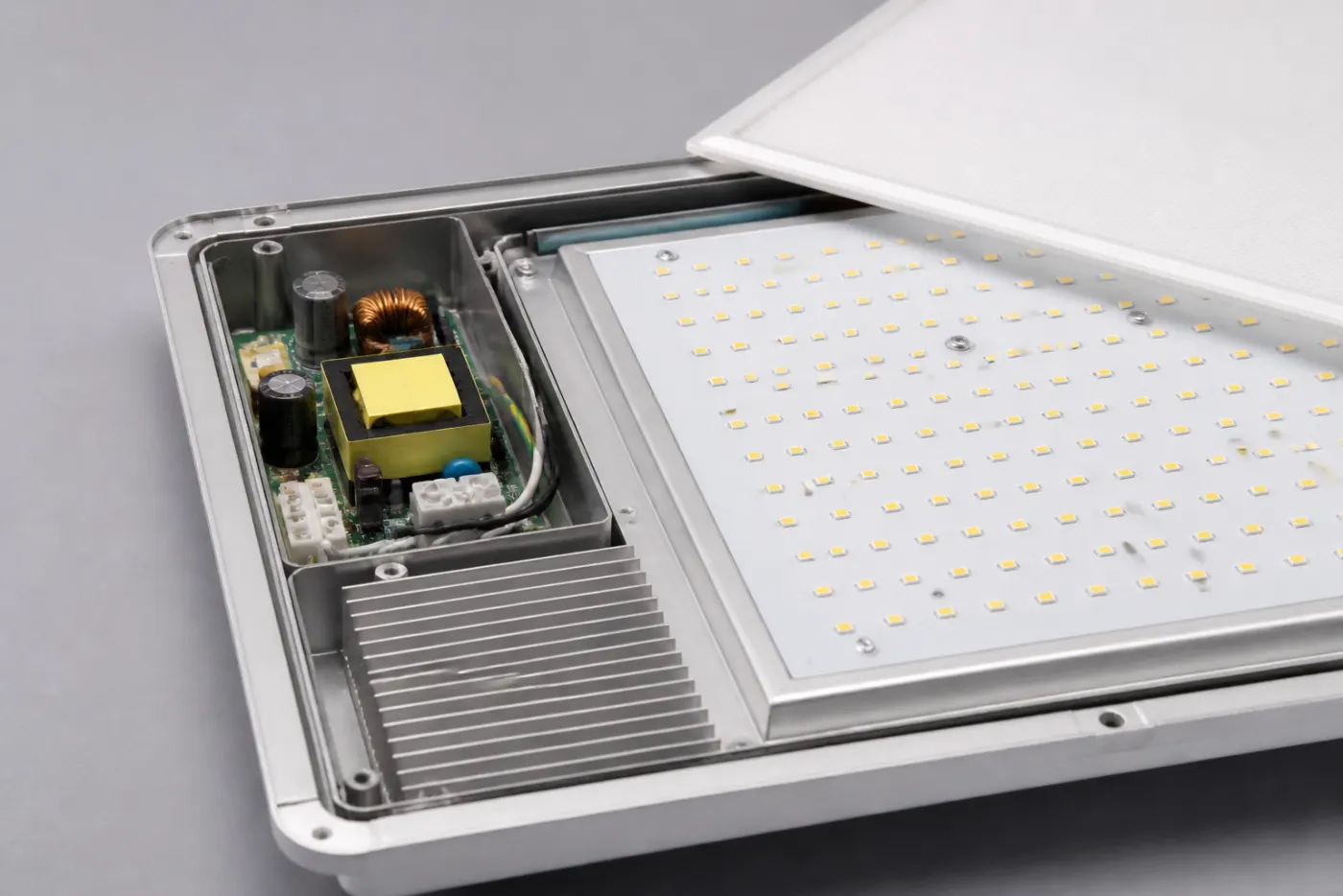 Close-up of LED panel light driver and internal components, the parts that determine how long LED lights last